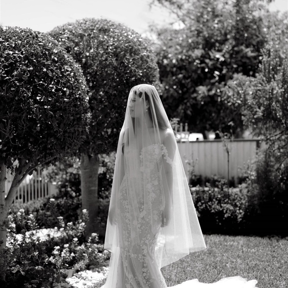 Solid white cathedral style tulle veil with blusher